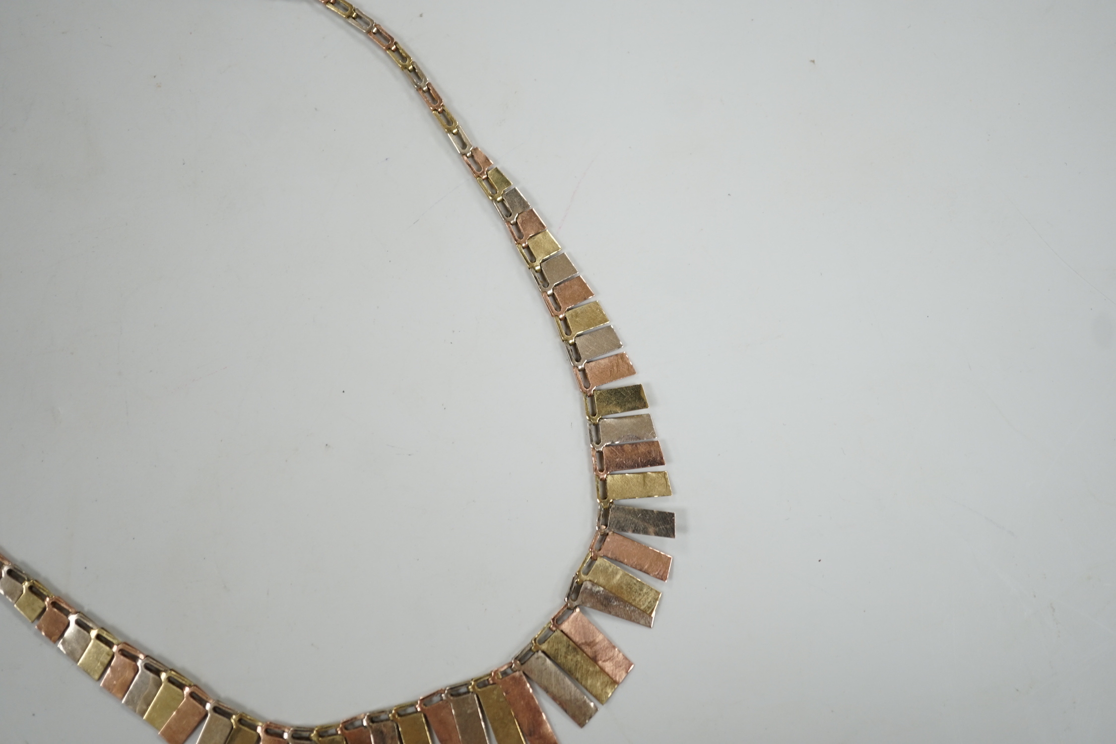 A modern three colour 9ct gold fringe necklace, 40cm